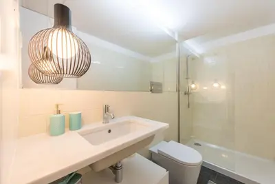 a bathroom with a sink and a toilet at GuestReady - Coral Apartment in Porto