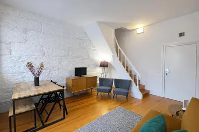 a bedroom with a bed with two towels on it at Oporto City View - Trindade in Porto