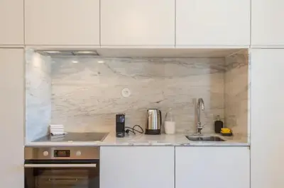 a kitchen with a sink and a counter top at Sweety Balcony Porto Center in Porto