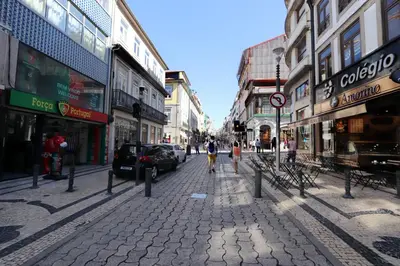 a city street with people walking down the street at HM - Sta. Catarina Charming Apartment in Porto