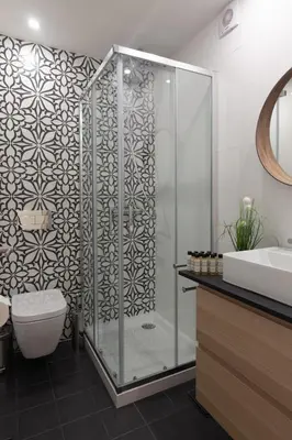 a bathroom with a shower with a toilet and a sink at Cinema Luxury House in Porto