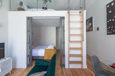a bedroom with a bunk bed with a ladder at Cinema Luxury House in Porto