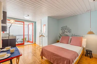 a living room with a staircase and a couch at Victoria Studios @ Clérigos in Porto
