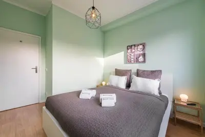 a bedroom with a large bed with two boxes on it at GuestReady - Wellspring Bloom in Porto