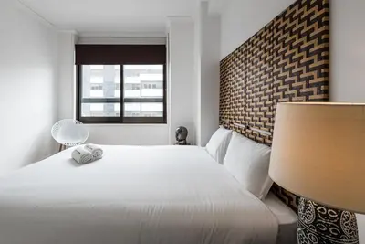 a bedroom with a white bed and a window at GuestReady - Mystic Subdual in Porto