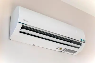 a white toaster oven sitting on a wall at LovelyStay - 2BR Flat with AC in Duque de Loulé in Porto