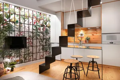 a kitchen with stools and a wall with a stained glass window at Jasmine Loft in Porto