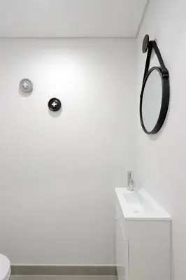 a bathroom with a sink and a mirror on the wall at HM - Vagus Oporto House in Porto