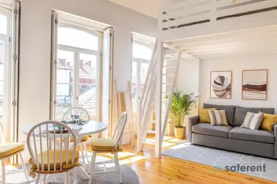 a living room with a couch and a table at Flores - Delight Loft Porto - Next to Ribeira in Porto