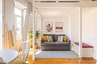 a living room with a couch and a table at Flores - Delight Loft Porto - Next to Ribeira in Porto