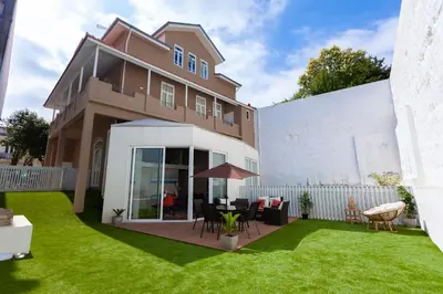 a house with a lawn in front of it at Oporto City View - Flora Garden in Porto