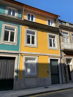 a colorful building on the side of a street at TMH Torrinha in Porto