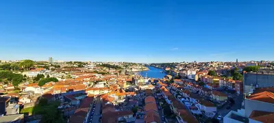 an aerial view of a city with a river at Porto River Sunset 7th in Vila Nova de Gaia