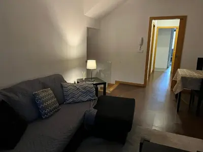 a living room with a couch and a table at Invicta House Gold in Porto