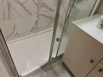 a bathroom with a shower with a glass door at Invicta House Gold in Porto