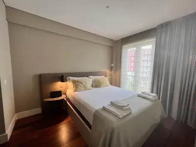 a bedroom with a large white bed with a window at New Oporto Apartments - São Bento in Porto