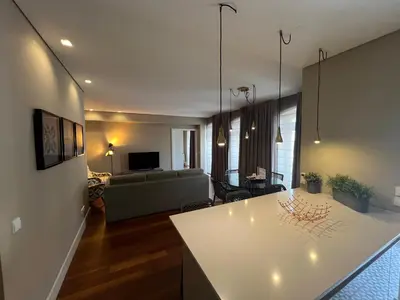 a living room with a couch and a table at New Oporto Apartments - São Bento in Porto