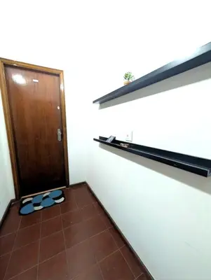 a pair of flip flops in a room with a door at Beautiful Infante Apartment in Porto