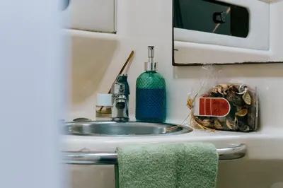 an rv kitchen with a refrigerator and a sink at SLEEPBOAT YACHT in Porto