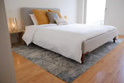 a bed with white sheets and pillows on it at Oasis in Porto by SpiritBnb in Porto
