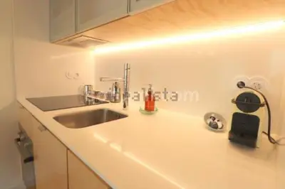a kitchen with a sink and a counter top at Oasis in Porto by SpiritBnb in Porto