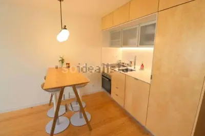 a kitchen with a wooden table in a room at Oasis in Porto by SpiritBnb in Porto