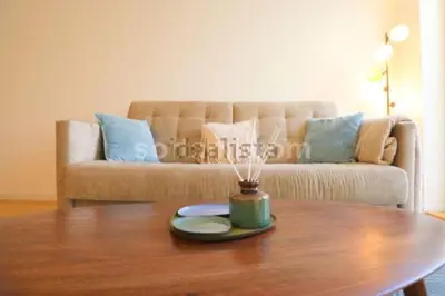 a coffee table in a living room with a couch at Oasis in Porto by SpiritBnb in Porto