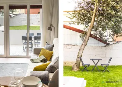 a living room with a couch and a tree at Bombarda Homes in Porto