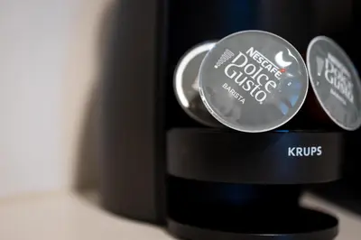 a close up of a coffee maker with labels on it at Solar Studio Fontainhas in Porto