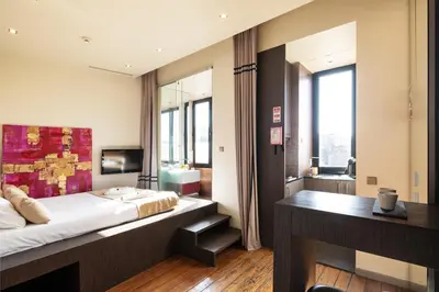 a bedroom with a bed and a desk in it at 118 Oporto Apartments in Porto