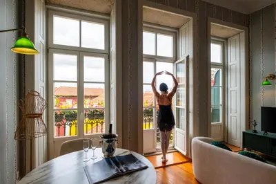 a ceiling light with a bike in a room at Luxury House Downtown Porto in Porto