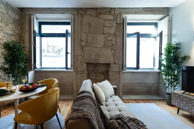 a living room with a couch and a table at Swimming Pool Luxury House 2 in Porto