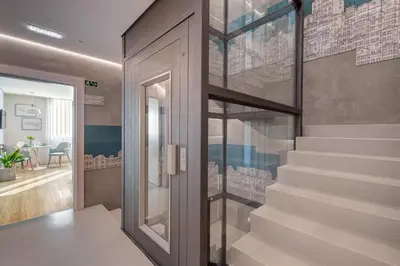 a staircase in a house with a glass door at 7 Bridges Estúdios- Porto-houses and suites in Porto