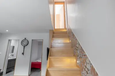 a staircase leading to the second floor of a house at OportoHost Campanhã in Porto