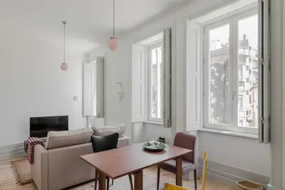 a living room with a couch and a table at Charming Camões Apartment in Porto with AC & Wi-Fi in Porto