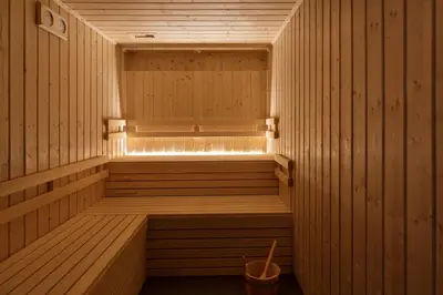 a wooden sauna with a bucket in it at Eurostars Aliados in Porto