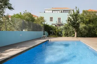 a swimming pool in the backyard of a house at Porto Pool Spot in Porto