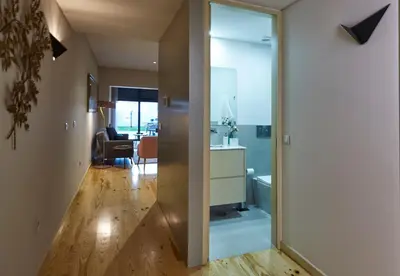 a kitchen and living room with a sliding glass door at ChillHouse_Porto - Praça da República in Porto
