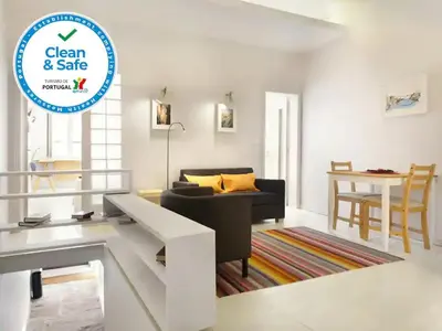 a living room with a couch and a table at O´Porto Outeiro Flat in Porto