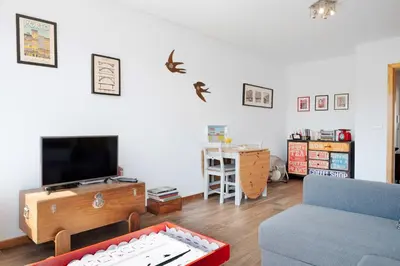 a living room with a couch and a flat screen tv at O´Porto Fontainhas Flat in Porto