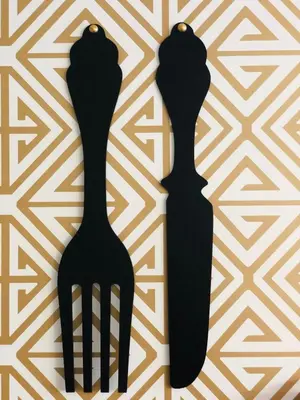 a table with a cup of coffee and spoons at Oporto Diamond Luxe & Terrace in Porto