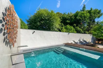 a swimming pool in the side of a wall at Villa Almada - Amazing City Centre Villa with Private Pool in Porto