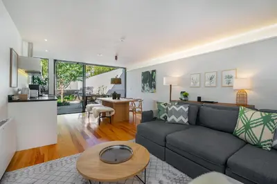 a living room with a couch and a table at Villa Almada - Amazing City Centre Villa with Private Pool in Porto