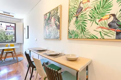 a kitchen with a table and chairs and a dining room at ON Apartments - Garden View 2 in Porto
