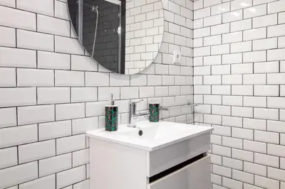 a white bathroom with a sink and a mirror at Alto da Lapa House w Parking by LovelyStay in Porto