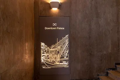 a sign with a picture of a bridge on a wall at CC Downtown Palace - B in Porto