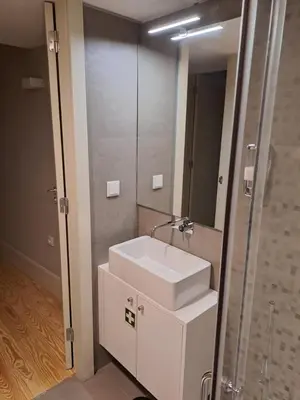 a bathroom with a sink and a mirror at CC Downtown Palace - B in Porto