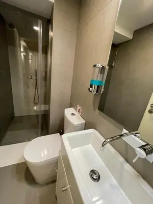 a bathroom with a sink and a toilet and a shower at CC Downtown Palace - D in Porto