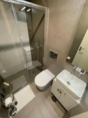 a bathroom with a toilet and a sink and a shower at CC Downtown Palace - E in Porto