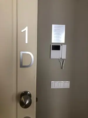 a door with a number and a paper on it at CC Downtown Palace - F in Porto